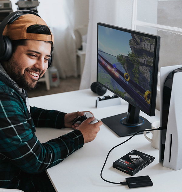 Man smiling while gaming with good Internet speed